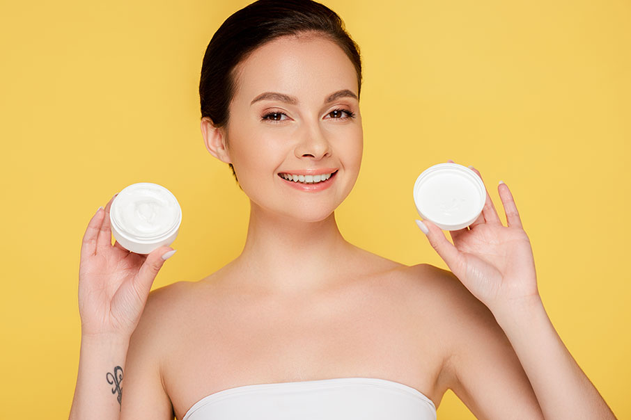 Smiling beautiful woman holding container